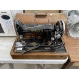 A VINTAGE SINGER SEWING MACHINE WITH WOODEN CASE - WORKING ORDER