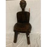 AN AFRICAN WOODEN CHAIR WITH A TRIBAL FIGURE HEAD