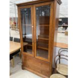 A WILLIS ABD GAMBIER CHERRY WOOD CABINET WITH TWO GLAZED DOORS AND TWO DRAWERS