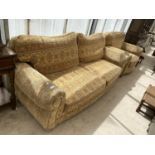 A TWO SEATER SOFA AND ARMCHAIR