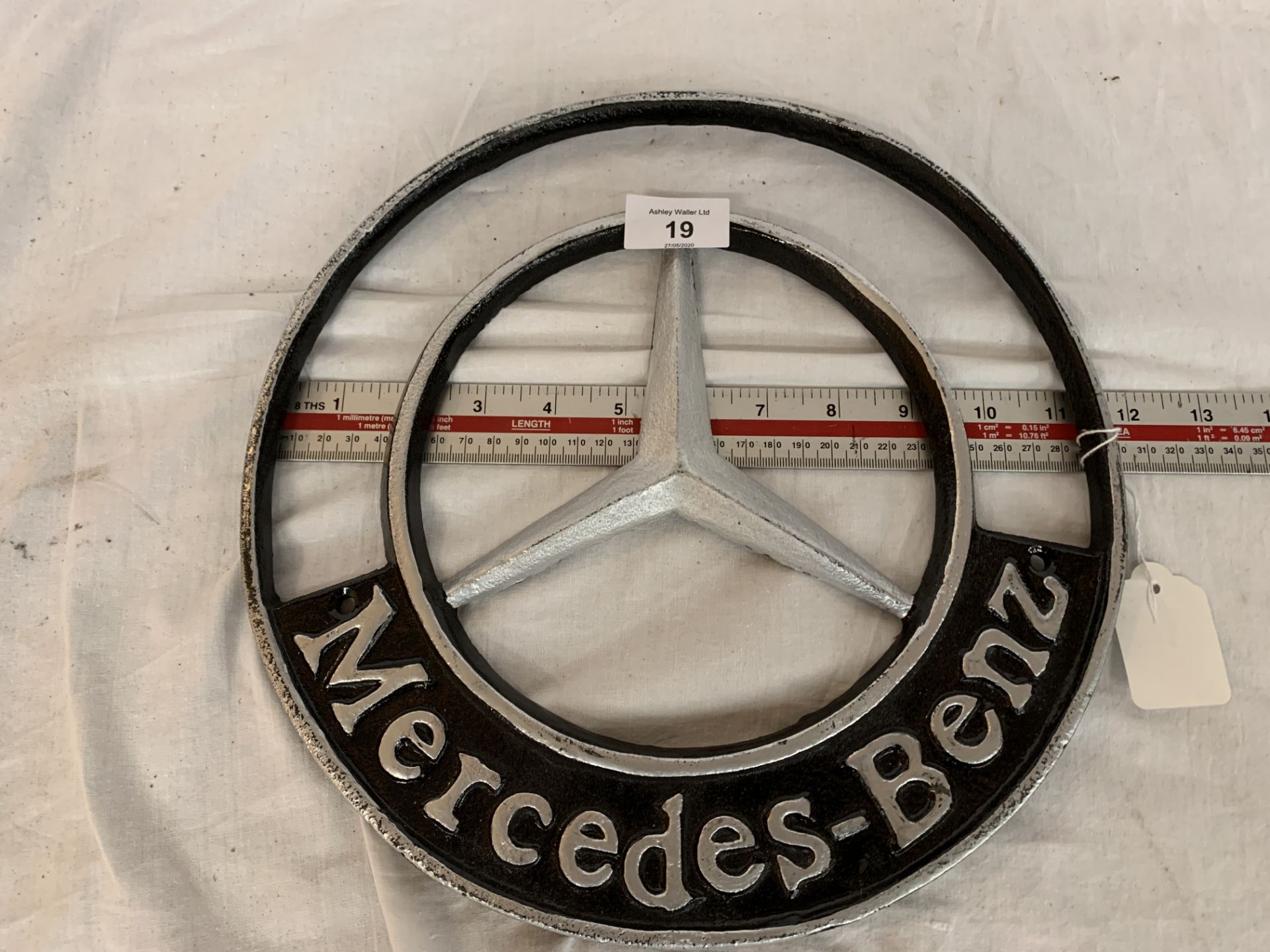 A CAST MERCEDES BENZ CIRCULAR SIGN 12 INCHES DIAMETER