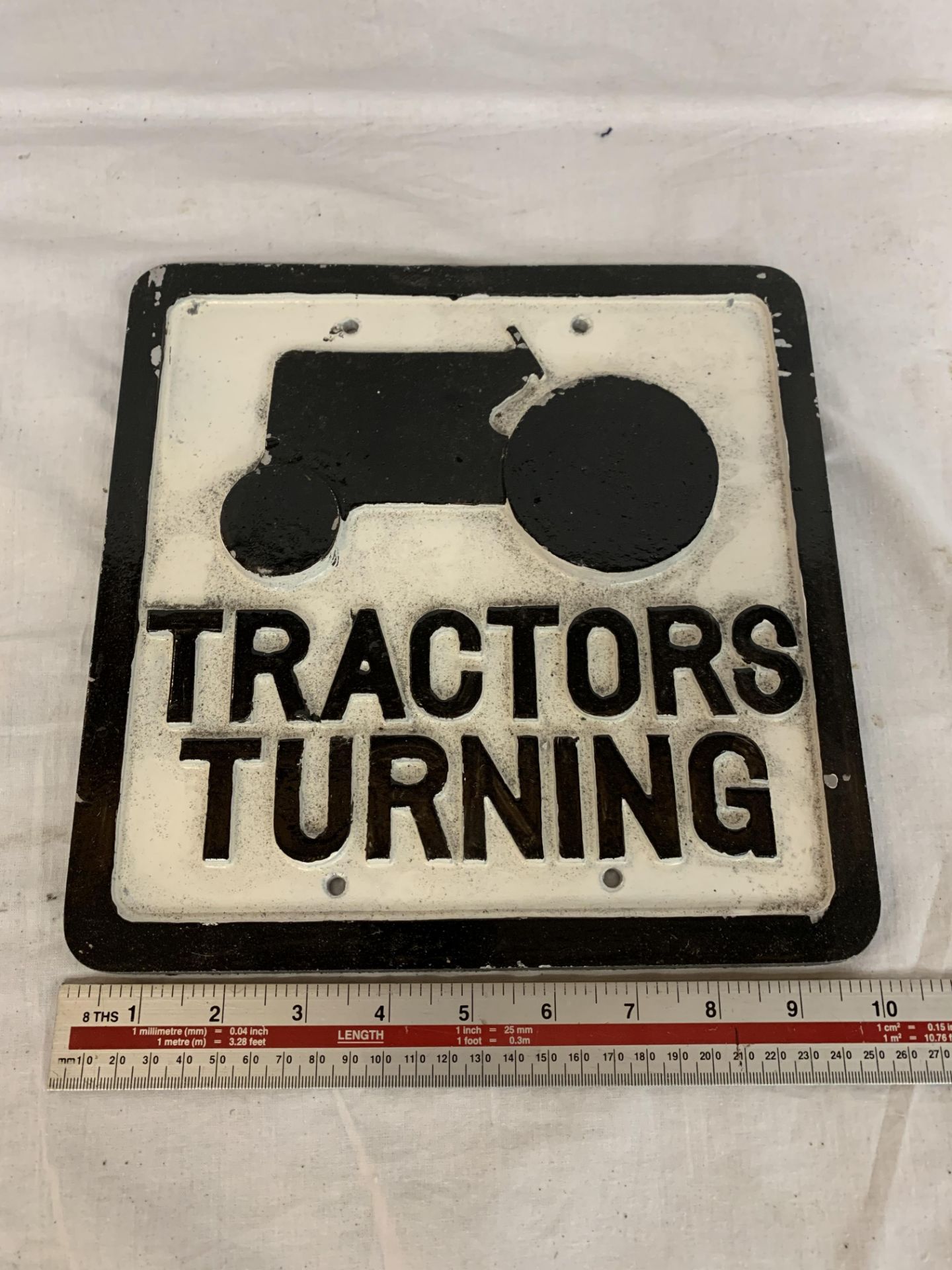 A CAST TRACTORS TURNING SIGN 10 X 10 INCHES