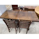 AN OAK REFECTORY DINING TABLE AND FOUR LADDER BACK DINING CHAIRS