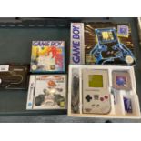 A NINTENDO GAMEBOY AND GAMES