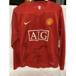 A SIGNED LABELLED LONG SLEEVE MANCHESTER UNITED SHIRT PRESENTED AT THE CHAMPION LEAGUE FINAL 2009 IN