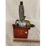 A VINTAGE BLACK AND DECKER UTILITY 1/4 INCH HORIZONTAL STAND WITH DRILL