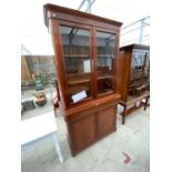 A MAHOGANY BOOKCASE CABINET WITH TWO LOWER DOORS AND TWO UPPER GLAZED DOORS