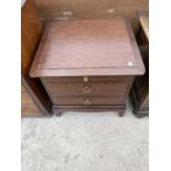 A STAG MINSTREL MAHOGANY BEDSIDE CHEST OF TWO DRAWERS