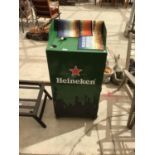 A HEINEKEN ADVERTISING STAND AND OTHER BEER BAR MATS ETC