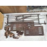 VARIOUS METALWARE O INCLUDE A METAL CHAIN WITH HOOK, GRATES, CROW BAR, METAL BARS ETC