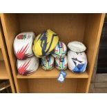 EIGHT VARIOUS RUGBY BALLS