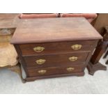A MAHOGANY CHEST OF THREE DRAWERS WITH BRASS HANDLES