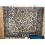 A LARGE BLUE PATTERNED RUG 394 CM X 282 CM