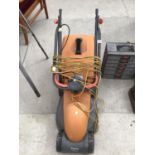 A FLYMO RE320 LAWNMOWER IN WORKING ORDER - IN WORKING ORDER.