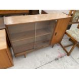 A RETRO TEAK CABINET WITH TWO SLING GLASS DOORS AND A FURTHER DOOR