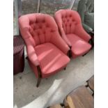 TWO UPHOLSTERED BUTTON BACK BEDROOM CHAIRS ON MAHOGANY SUPPORTS