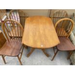 A BEECH DROP LEAF DINING TABLE AND FOUR DINING CHAIRS