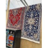 TWO PATTERNED RUGS - ONE BLUE, ONE RED 196 CM X 56 CM AND 85 CM X 157 CM