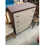 A MAHOGANY EFFECT CHEST OF FIVE DRAWERS