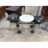 TWO BBQS AND A METAL CIRCULAR TABLE