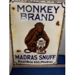 AN ENAMEL 'MONKEY BRAND MADRAS SNUFF POST BOX 555, MADRAS' ADVERTISING SIGN