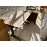 AN OAK LIBRARY TABLE AND A RETRO DROP LEAF TEAK DINING TABLE