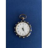 EARLY 20TH CENTURY MANUAL LADIES WHITE MEATL FOB WATCH DECORATED WITH BLUE PASTE STONES AND PEARLS