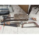 A METAL BOX AND VARIOUS SAWS