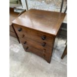 A MAHOGANY COMMODE DISGUISED AS A CHEST OF DRAWERS