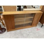 A GIBBS RETRO TEAK DISPLAY BOOKCASE WITH TWO SLIDING GLASS DOORS