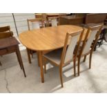 AN OAK DINING TABLE AND FOUR CHERRY WOOD DINING CHAIRS