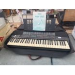 A YAMAHA PORTATONE PSR-215 KEYBOARD