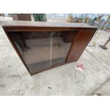 A MAHOGANY CABINET WITH SINGLE DOOR AND TWO SLIDING GLASS DOORS