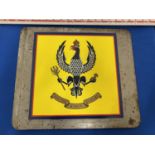 A KING'S HUSSARS CREST ON METAL PLATE