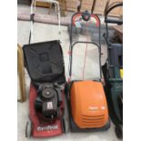 A MOUNTFIELD LAWNMOWER AND A FLYMO LAWN RAKE COMPACT 3400