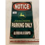 A 'JOHN DEERE PARKING ONLY ALL OTHERS WILL BE SCRAPPED' METAL SIGN