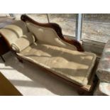A VICTORIAN CARVED MAHOGANY CHAISE LONGUE