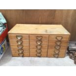 A VINTAGE PINE PLAN CHEST WITH FIFTEEN DRAWERS