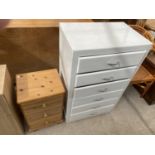 A PINE BEDSIDE CABINET AND A WHITE CHEST OF SIX DRAWERS