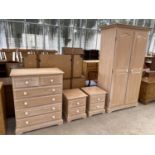A FOUR PIECE LIMED OAK BEDROOM SUITE - A CHEST OF TWO SHORT AND FOUR LONG DRAWERS, TWO BEDSIDE