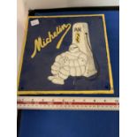 A CAST MICHELIN MAN SIGN