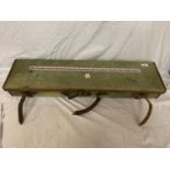 A GREEN CANVAS GUN CASE WITH LEATHER STRAPS (HANDLE A/F)