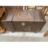 A CARVED CAMPHOR WOOD BEDDING CHEST