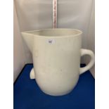 A VERY LARGE WHITE MIXING JUG