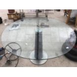 A LARGE CIRCULAR GLASS TOPPED TABLE DIAMETER 120CM