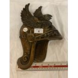 A CENTURION'S BRASS HELMET PLAQUE WITH EAGLE DESIGN