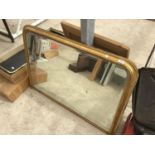 A LARGE GILT FRAMED MIRROR 115CM X 78CM