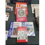 FIVE VARIOUS STAMP AND COIN COLLECTING BOOKS TO INCLUDE STANLEY GIBBONS