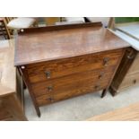 AN OAK CHEST OF THREE DRAWERS