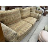 A TWO SEATER SOFA AND ARMCHAIR